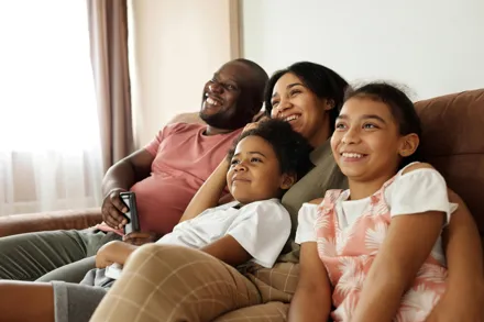 Family watching CTL Cable TV in Jamaica